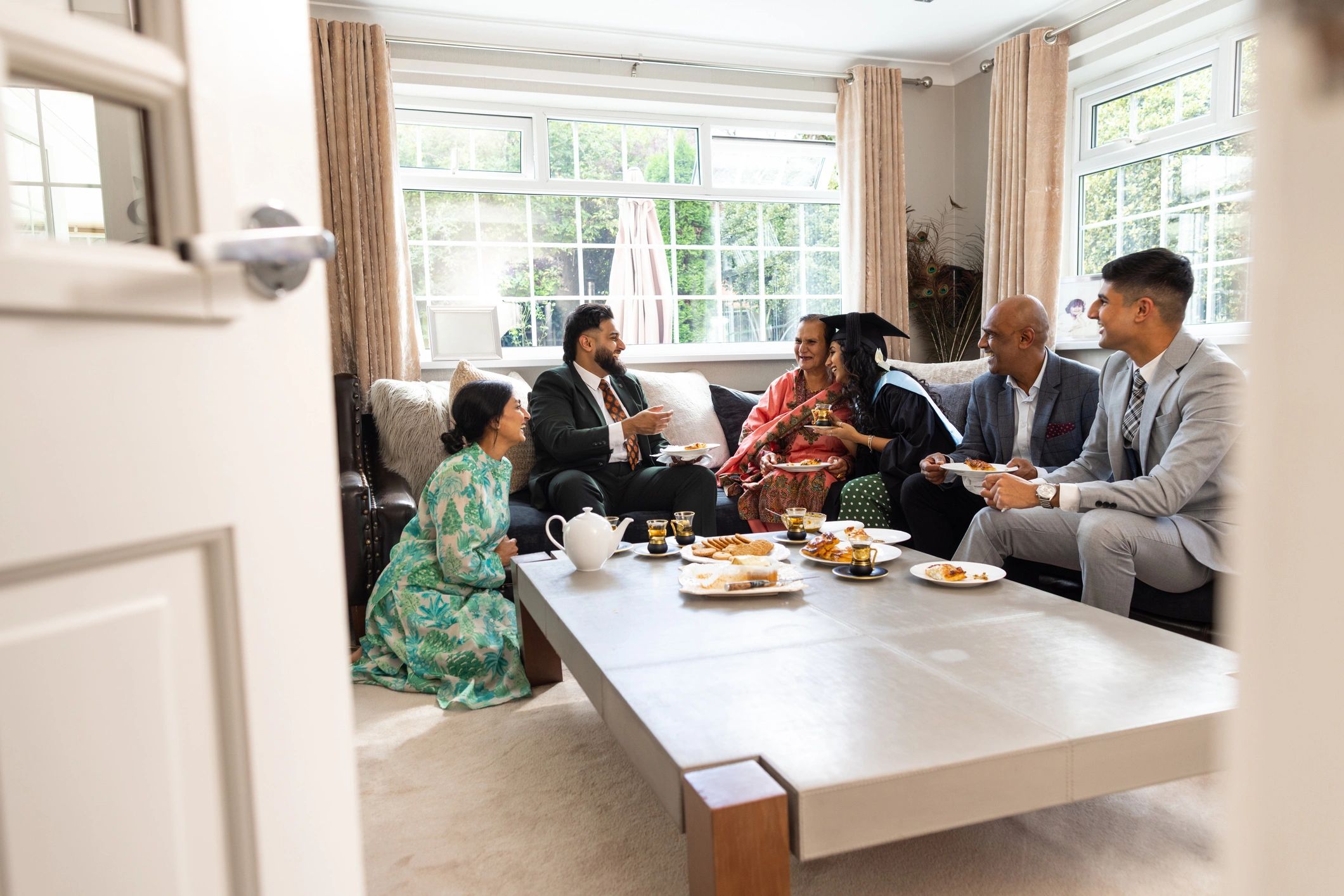 Family relaxing together in a bright, comfortable living room